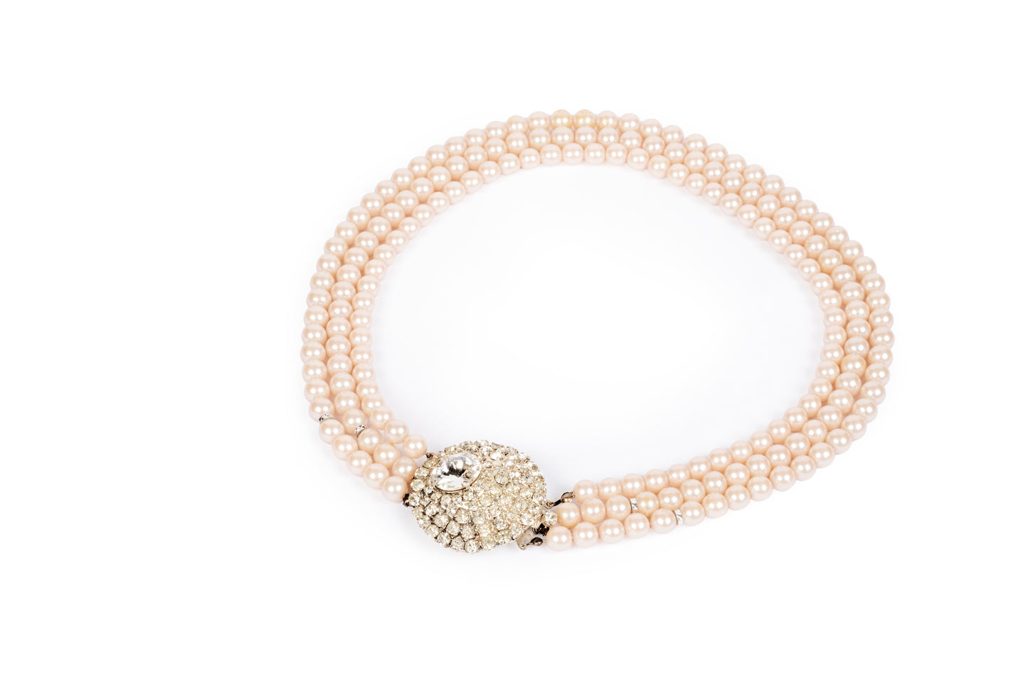 Three-strand pink pearl necklace with crystal center