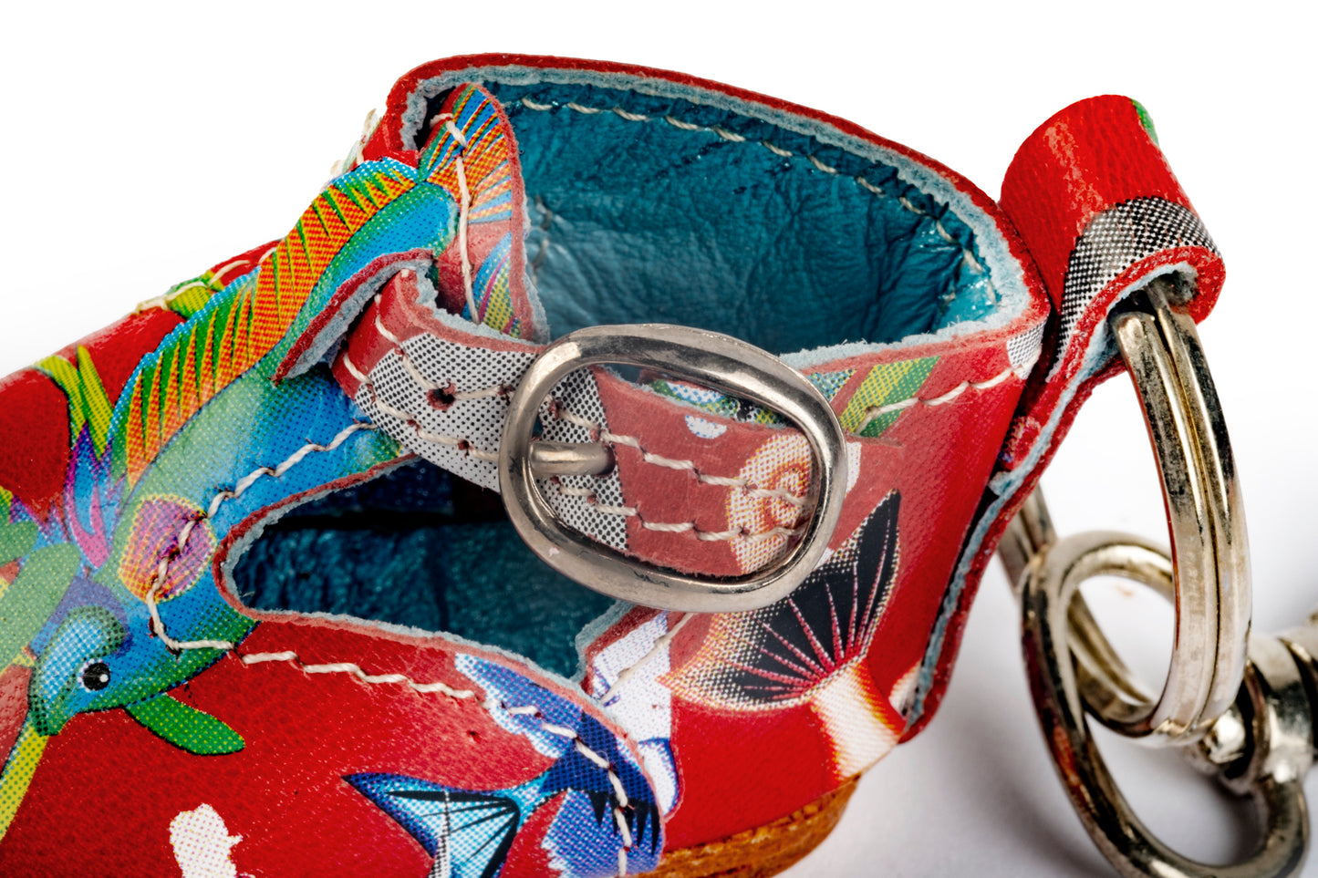 Red baby shoe keyring with fish pattern