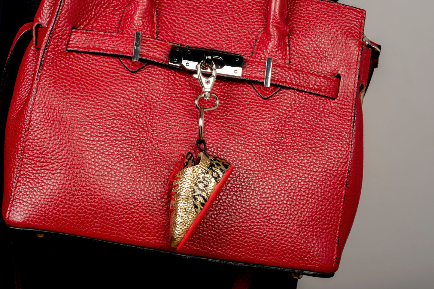 Spotted gold tennis shoe keychain